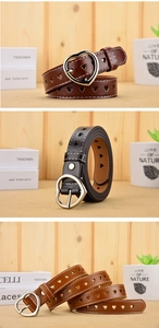 Detailed view of women's PU leather belts with heart-shaped buckles and hollow cutouts
