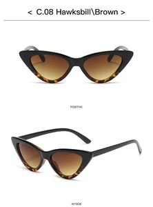 Detail view of cat eye sunglasses showing hawksbill frame and brown gradient lenses
