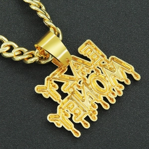 Macro shot of gold hip-hop Money pendant with melting effect on dark textured background