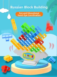 Detail of colorful Tetris-style balancing blocks on a white pedestal base game
