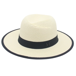 Chic beige straw Panama hat with black ribbon, metal M logo, and contrast brim edging