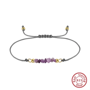 Detail of adjustable woven cord bracelet with natural purple stones and 925 silver beads