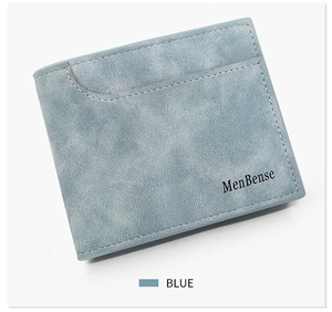 Close-up of matte light blue leather wallet with embossed MenBense logo and fine texture