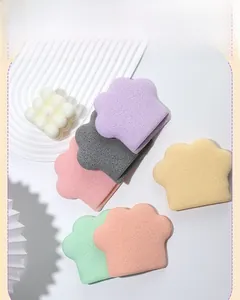 Detailed view of colorful cat paw shaped facial sponges in various pastel colors