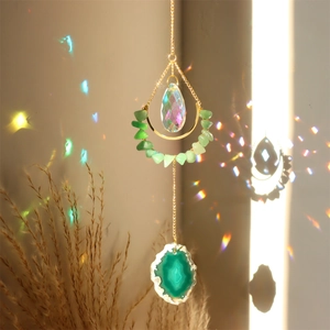 Natural agate suncatcher with crystal prism and moon crescent hanging by golden chain