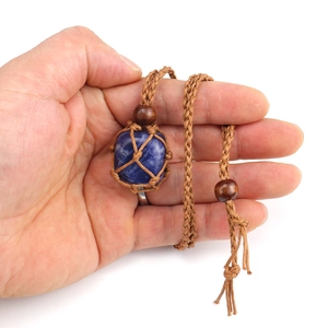 Handmade woven net necklace with natural blue crystal stone and adjustable brown cord