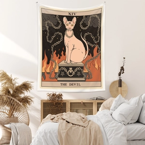 Detail of The Devil Tarot tapestry featuring a Sphynx cat hung on a bedroom wall