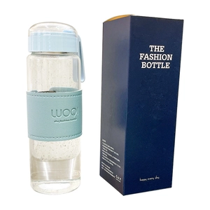 Minimalist glass bottle with light blue leather sleeve and premium matching gift box