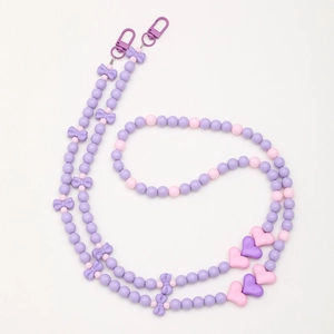 Pink and purple beaded crossbody phone chain with heart and bow-knot charms