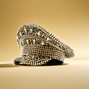 Macro detail of leopard print hat featuring gold punk spikes and sparkling rhinestones