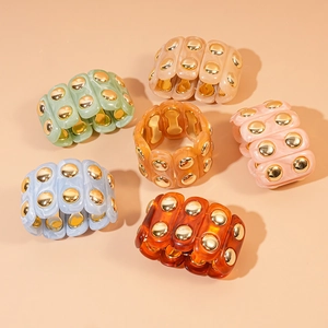 Chic marbled acrylic stretch bracelets with gold accents in various pastel colors