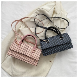 Detail view of stylish crossbody bags with circular logo texture and gold metal buckles