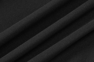 Vue macro détaillée de la texture du tissu en maille noire et des coutures fines