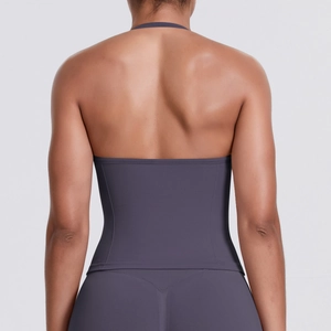 Back view of a seamless high-stretch sports set in dark purple with racerback design