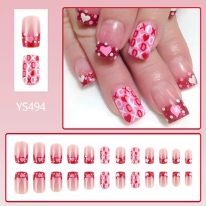 Short square press-on nails with red heart patterns and XOXO glitter Valentine design