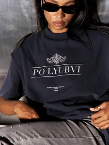 Close-up of graphic lettering on a navy cotton T-shirt featuring high-quality screen print