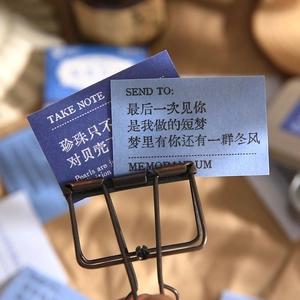 Artistic stationery set with blue decorative cards and antique bronze metal clip