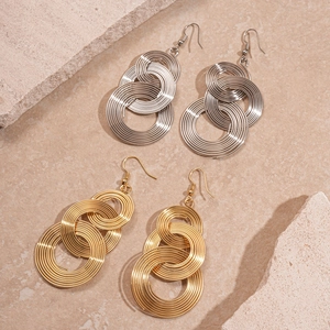 Hollow geometric tiered metal hoop earrings in gold and silver finish with hooks
