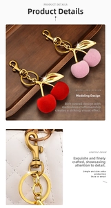 Detail of flocked cherry keychains in red and pink with gold metal leaf and lobster clasp