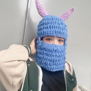Detail of royal blue hand-crocheted balaclava featuring contrasting purple devil horns