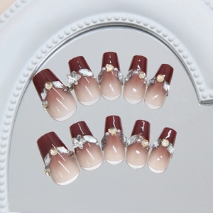 Deep wine red ombre coffin press-on nails with sparkling rhinestones and bow accents