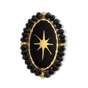 Macro detail of French vintage oval lapis lazuli pendant with gold star motif and bead trim