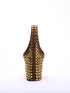 Detail view of leopard print texture with golden rivets on a punk style shoulder bag