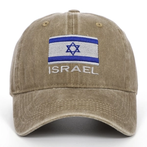 Close-up of Israel flag embroidery and lettering on washed khaki cotton baseball cap