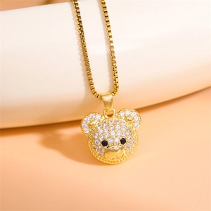 Sparkling gold teddy bear pendant necklace with zircon inlay and black gem eyes