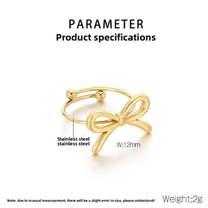 Detailed close-up of a golden stainless steel bow ring with adjustable open design and beads