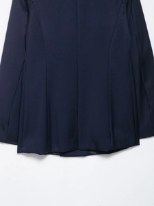 Close-up of the back seam and fine fabric texture on a navy blue tailored blazer