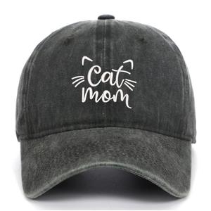 Close-up of white Cat Mom embroidery on washed black cotton denim baseball cap