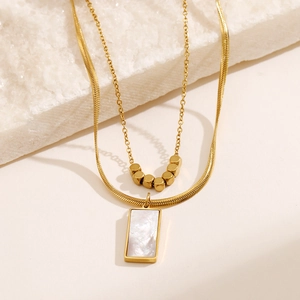 Double-layered 18k gold plated necklace with white shell pendant and square beads