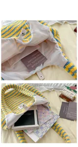 Detail view of large striped plush tote bag with magnetic closure and soft lining