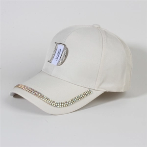 Close-up of beige denim baseball cap with colorful rhinestones and motorsport logo