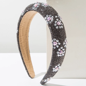 Detailed view of the dark grey rhinestone headband with silver flowers and pink heart stones