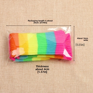 Macro detail of rainbow striped knit leg warmers showing colorful yarn texture and dimensions