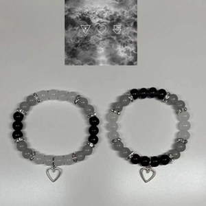 Close-up of elastic beaded heart bracelets with crystal spacers and heart charms