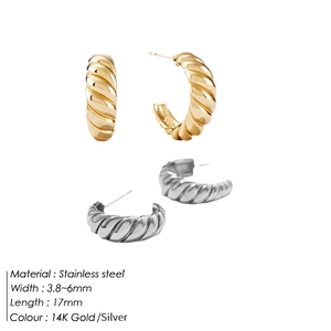 Detail of twisted croissant hoop earrings in gold and silver stainless steel