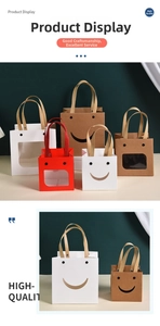 Detail of creative smiley gift bags in red, white and kraft with PVC windows