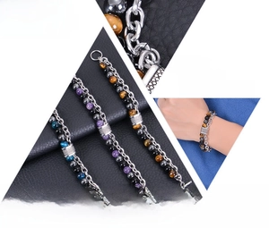 Macro detail of men's tiger eye stone and stainless steel beaded bracelet with OT clasp