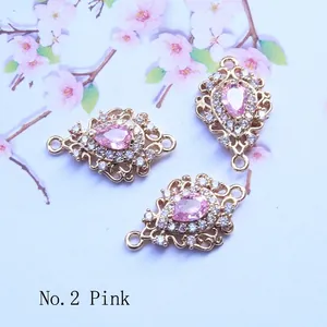 Pink pear-shaped crystal pendant with gold plating and white zircon micro-inlay