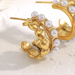 Chic 18K gold plated heart chain earrings with white faux pearls on white background