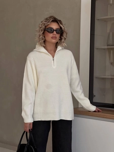 Cream waffle knit sweater with half-zip design in a loose, cozy relaxed fit for autumn