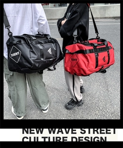 Detail view of durable oxford fabric travel bags in black and red with reinforced handles