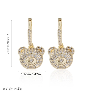 Detailed view of gold bear earrings with crystals, size 2.5cm by 1.2cm and 4.3g weight