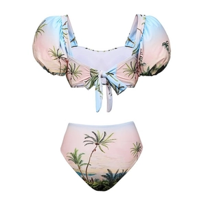 Detail view of sunset gradient bikini with palm tree print and puff sleeve top