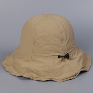Detail of khaki sun hat with adjustable drawstring and quick-dry breathable fabric