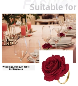 Close-up of artificial red rose napkin ring with a polished gold metal base for banquet