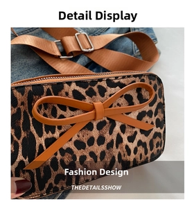 Detailed macro view of leopard print small crossbody bag with a brown ribbon bow accent